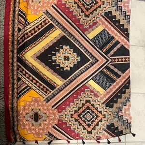 Geometric Patterned Textile Scarf in Red, Yellow, and Black